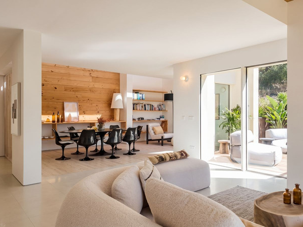 Open-plan living room with sliding doors to the terrace