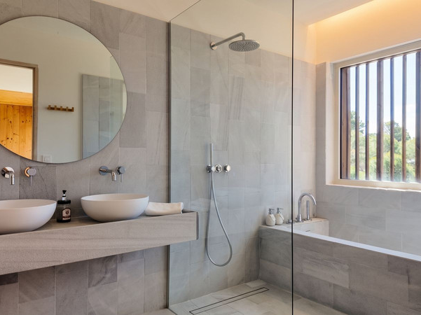 Contemporary bathroom in natural stone finishes