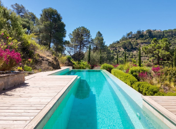 Infinity-style swimming pool and sun terrace