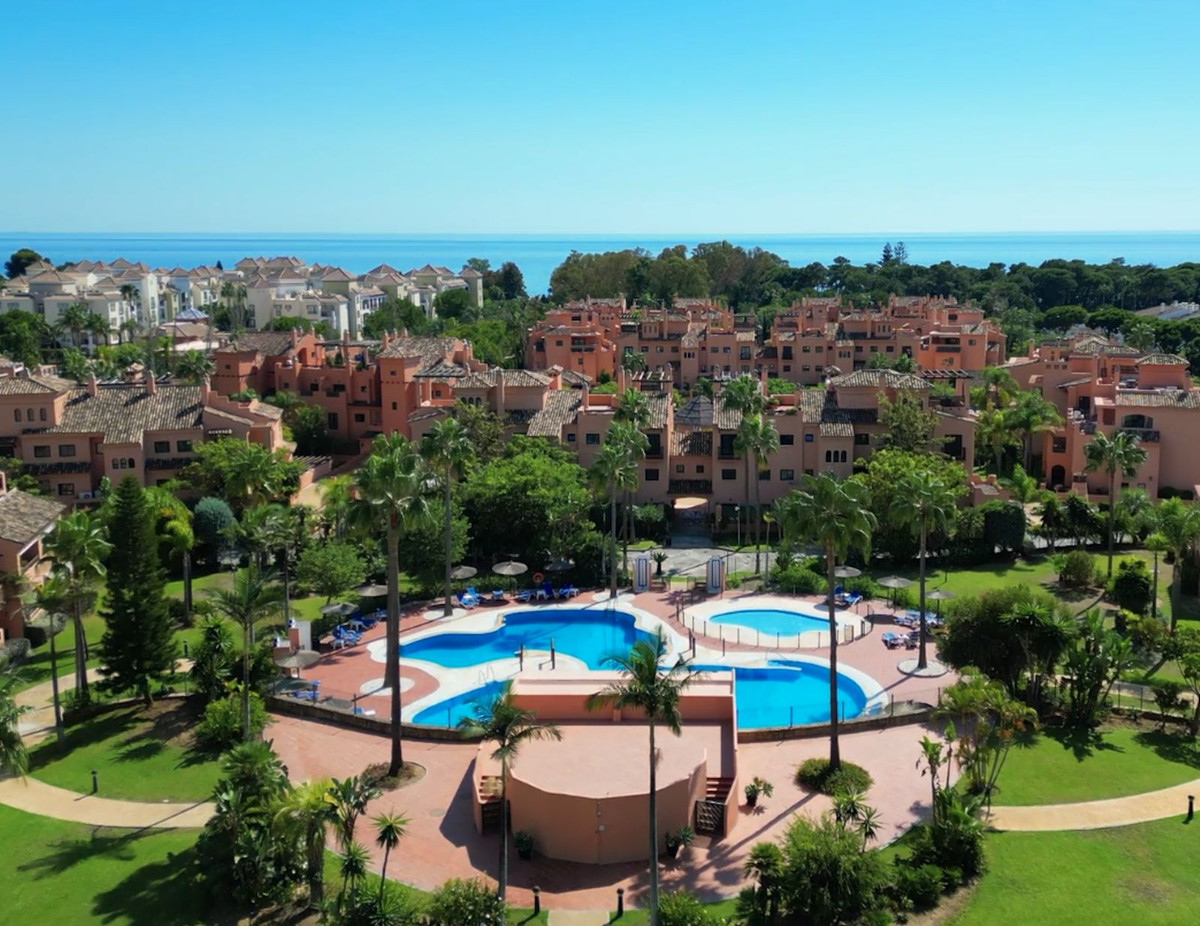 Aerial view of the beachside urbanisation and its pools